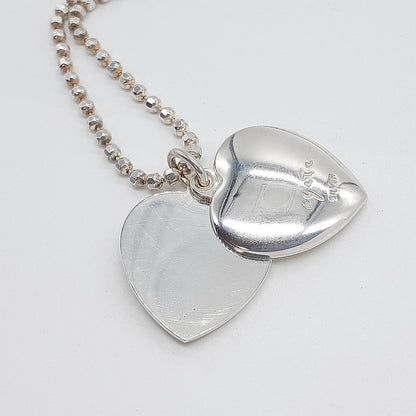 Agete heart-shaped silver necklace with heart rocket and clover charm on silver chain