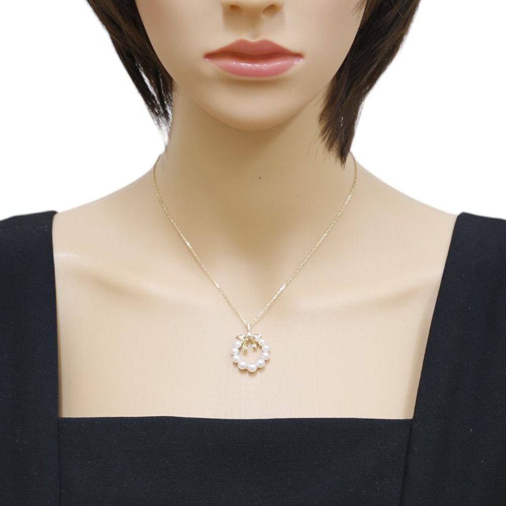 Mikimoto 18K yellow gold necklace featuring a single Akoya pearl and diamond accents for ladies