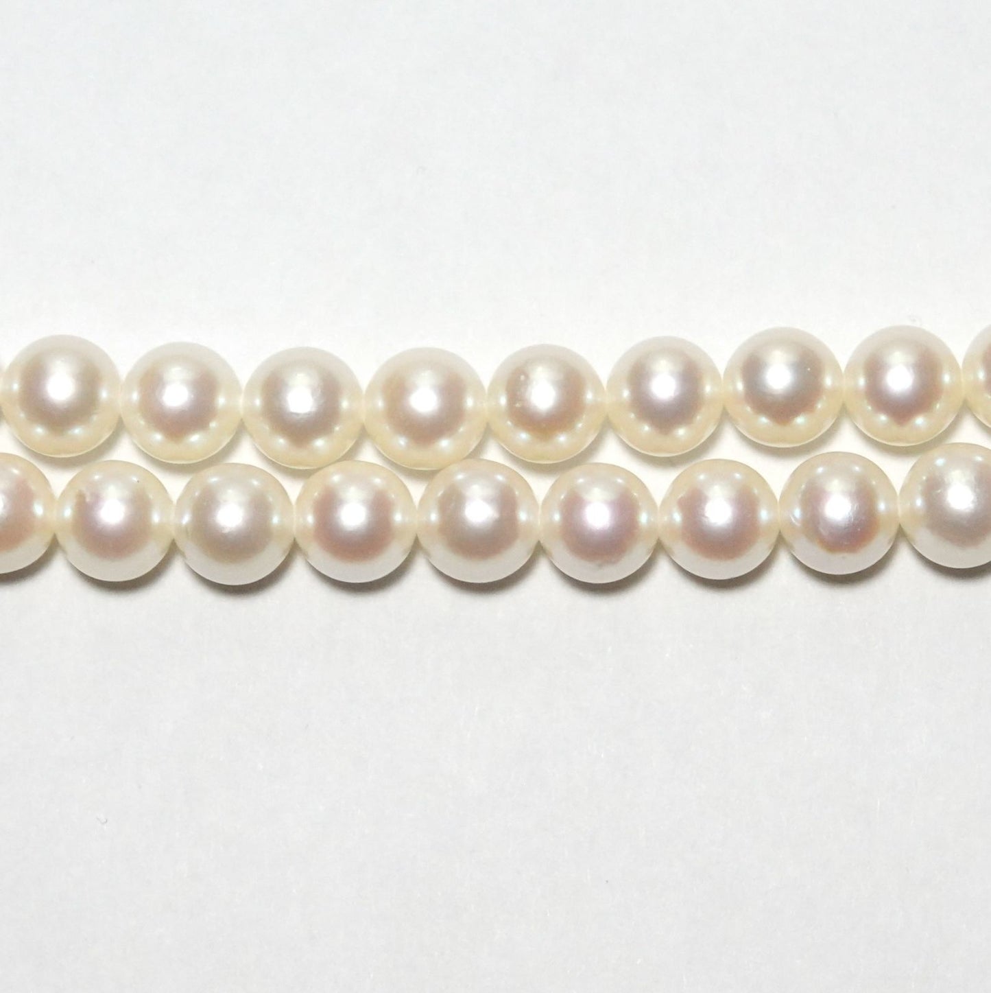 Tasaki Akoya pearl long necklace with 6.5-6.8mm pearls and silver clasp measuring 122cm