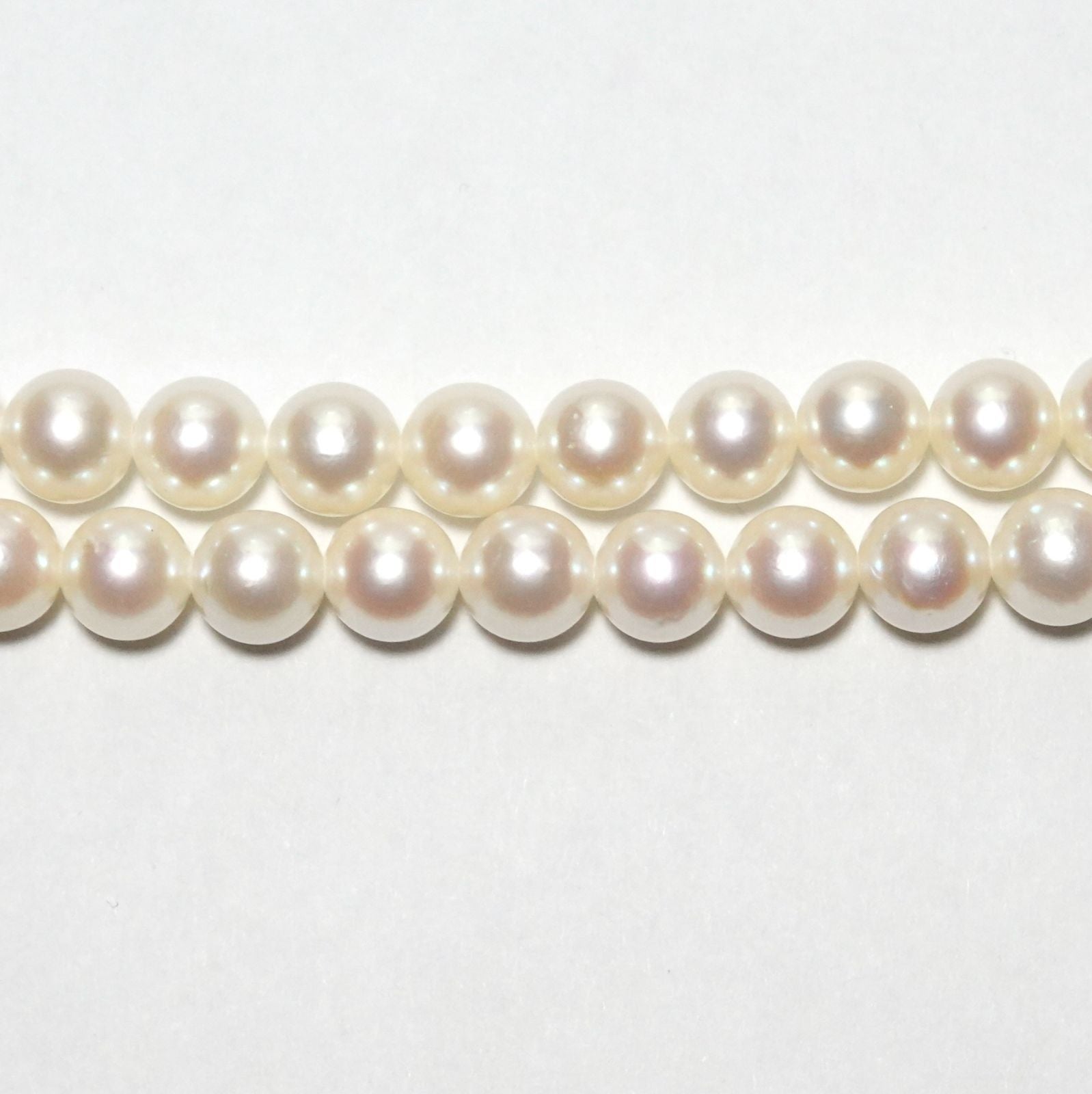 Tasaki Akoya pearl long necklace with 6.5-6.8mm pearls and silver clasp measuring 122cm