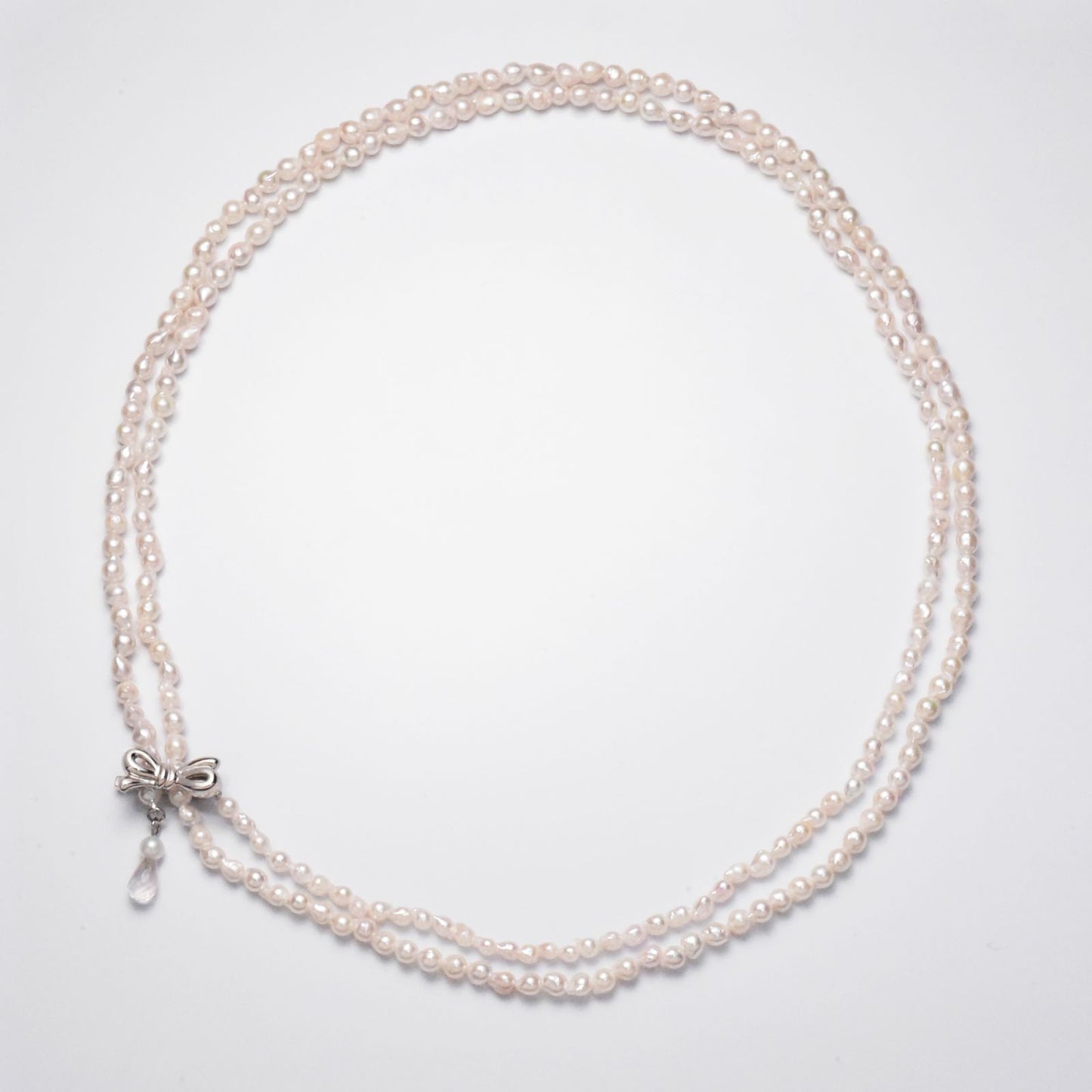 Baroque shape Akoya pearl necklace with 3-3.5mm pearls and rose quartz ribbon clasp, 80cm long