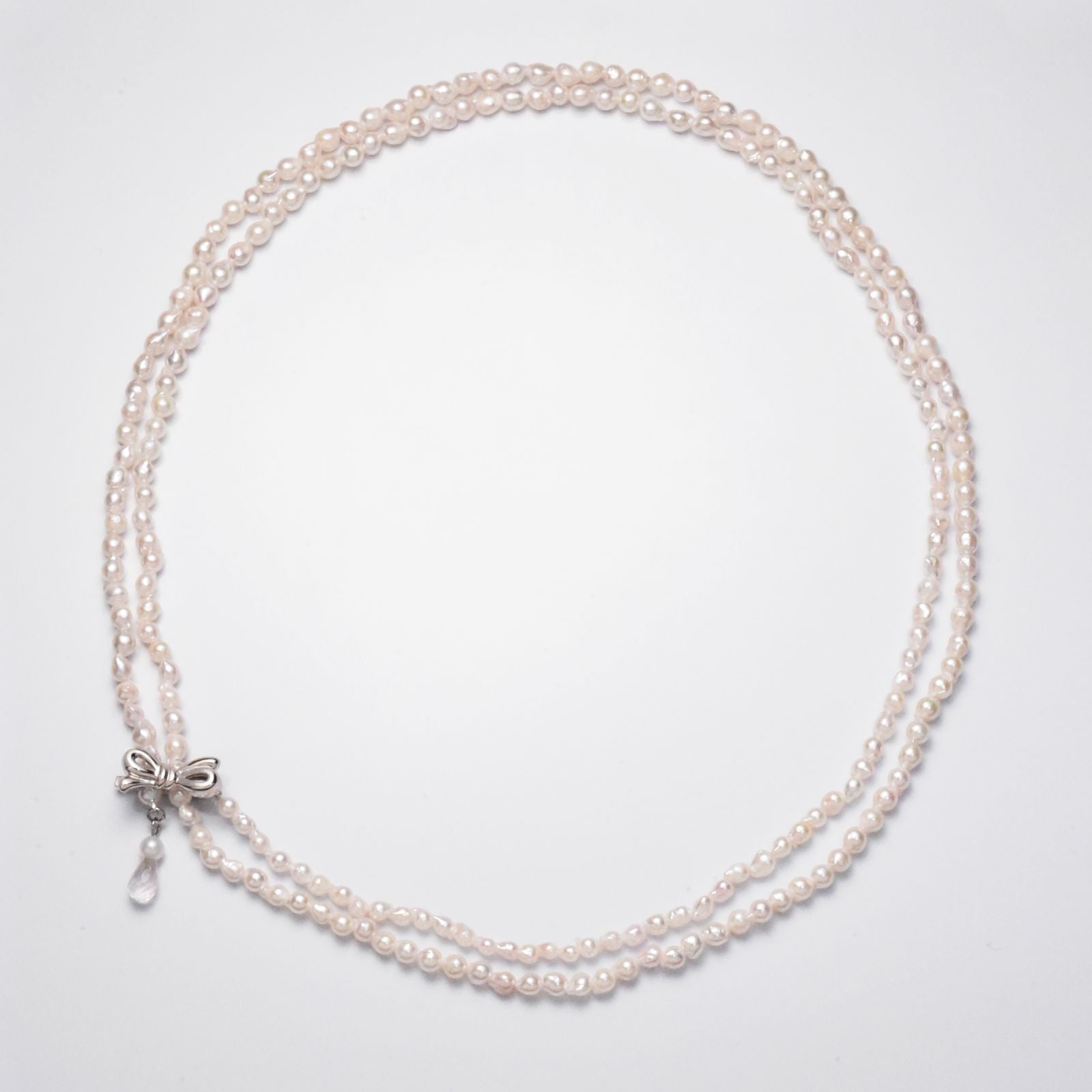 Baroque shape Akoya pearl necklace with 3-3.5mm pearls and rose quartz ribbon clasp, 80cm long