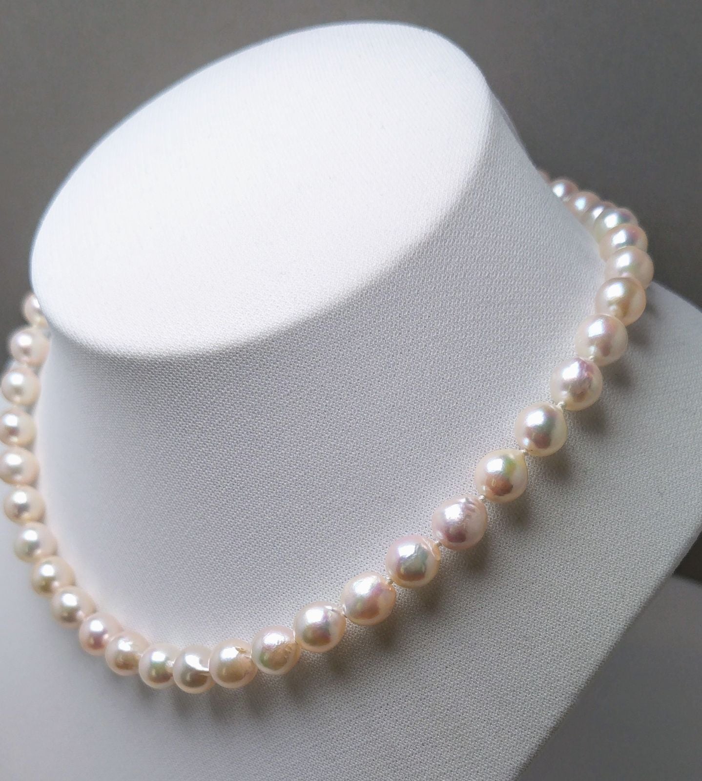 Akoya pearl necklace featuring 9.0-8.5mm white pink semi baroque pearls with unique indentations and good luster
