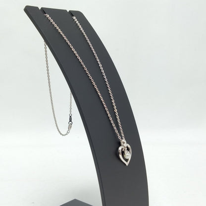 MIKIMOTO silver heart necklace with a 0.5cm pearl pendant and 19cm chain on white background