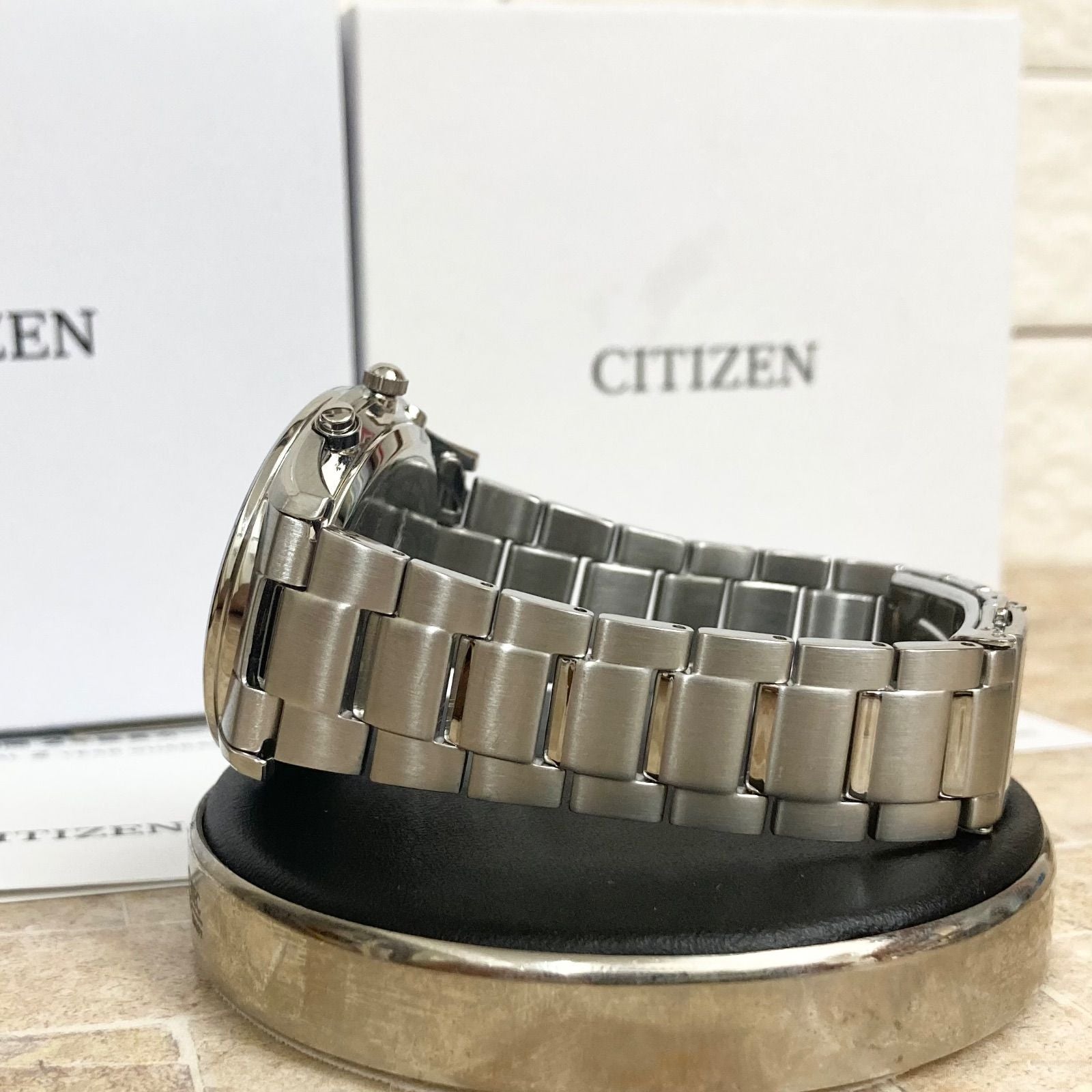 Citizen Eco-Drive men's radio-controlled watch model H415-S112907 with silver case and black band