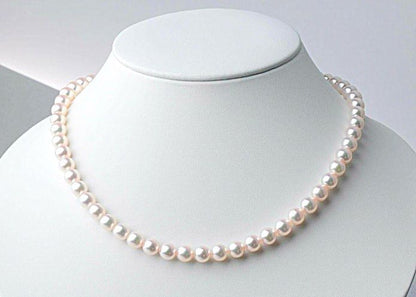 Akoya pearl necklace with 7.0mm-7.5mm white round to semi-round pearls and stainless steel push clasp