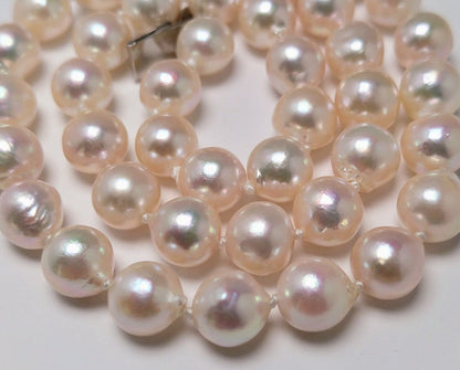 Akoya pearl necklace featuring 9.0-8.5mm white pink semi baroque pearls with unique indentations and good luster