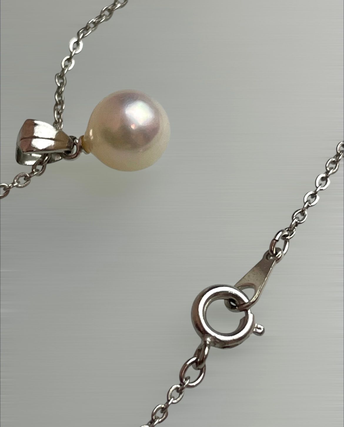Akoya pearl necklace with a single 8.5mm white pearl on a silver chain