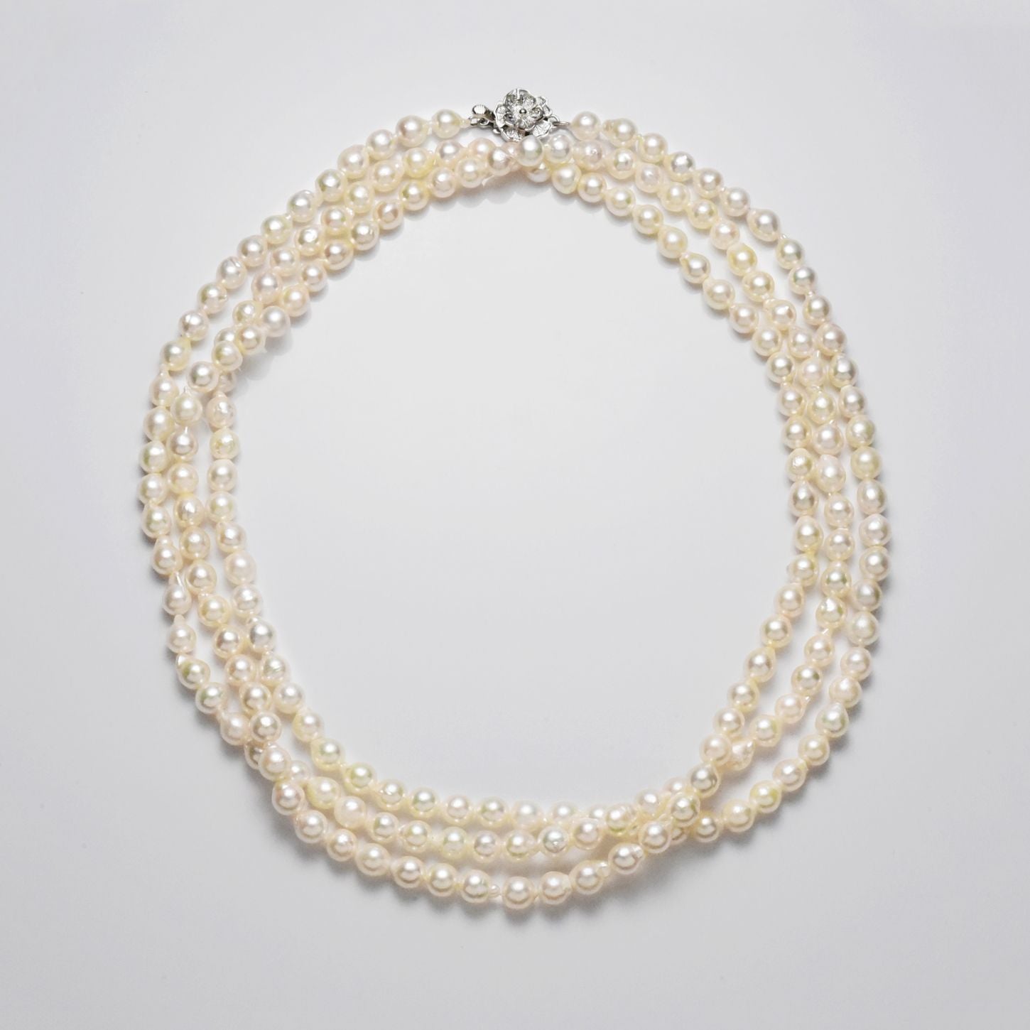 Akoya cultured pearl 5.5-6mm baroque shape long 120cm necklace with silver clasp on white background