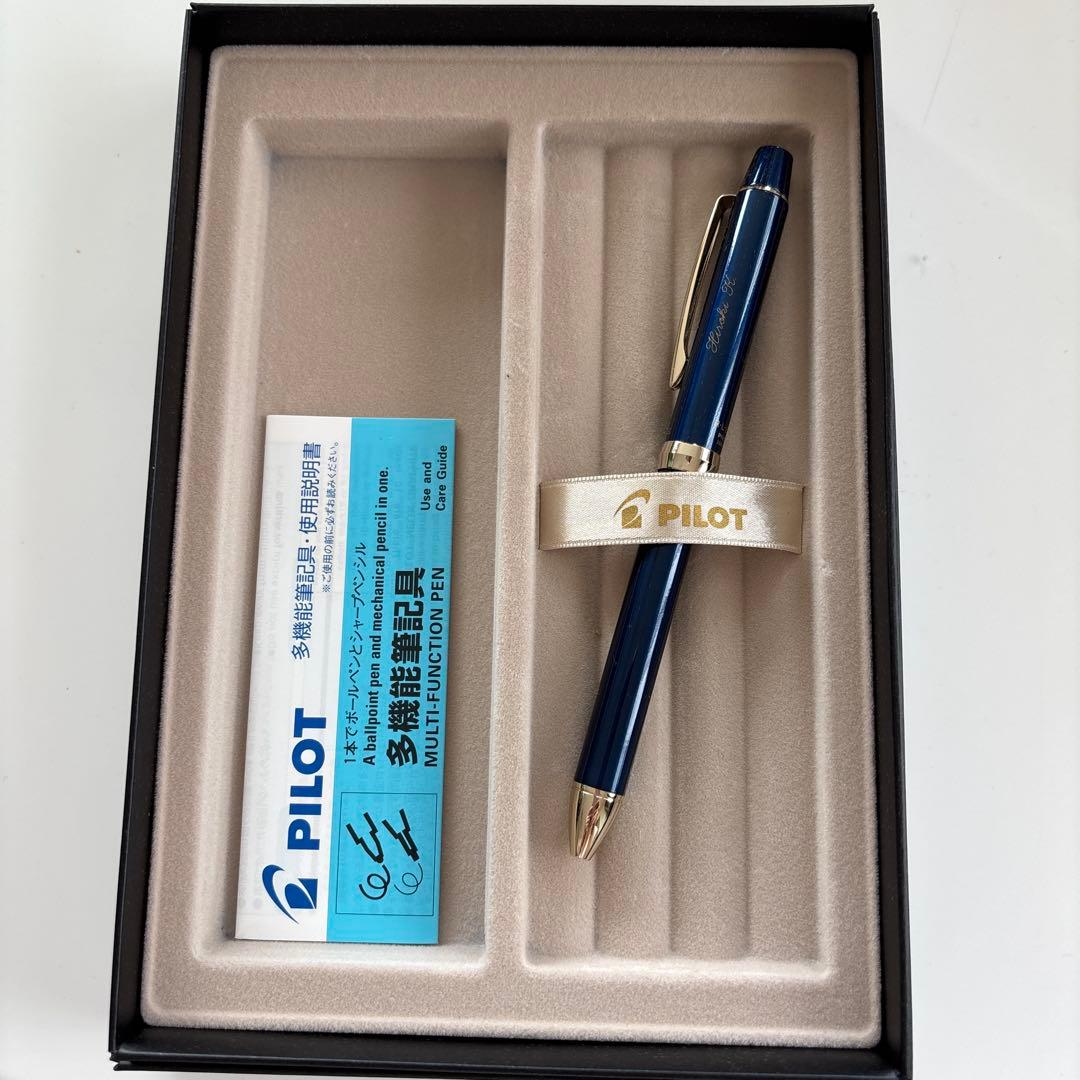 Pilot multi-function pen in navy color with a protective case displayed