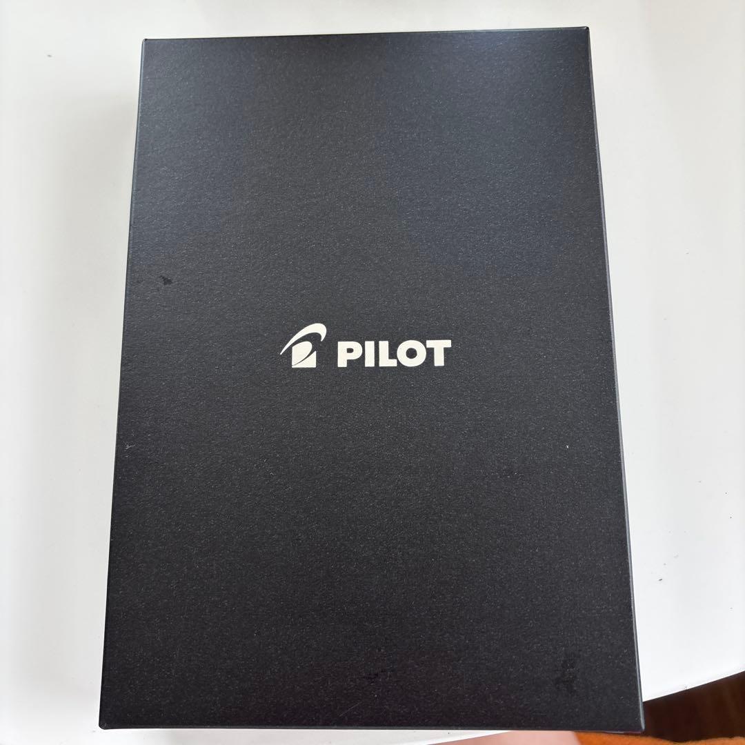 Pilot multi-function pen in navy color with a protective case displayed