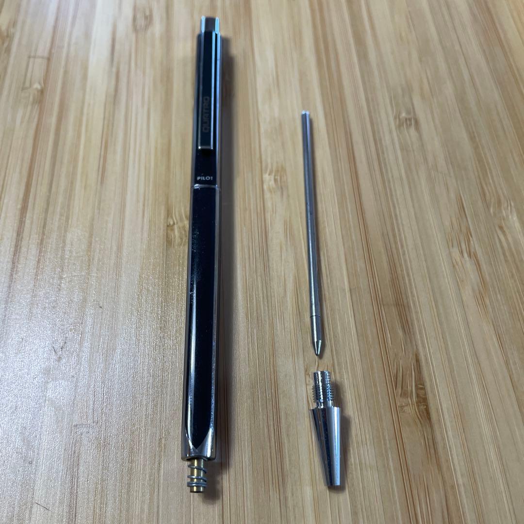 PILOT Quattro black ballpoint pen shown with cap and medium point tip
