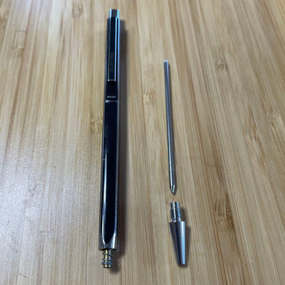 PILOT Quattro black ballpoint pen shown with cap and medium point tip