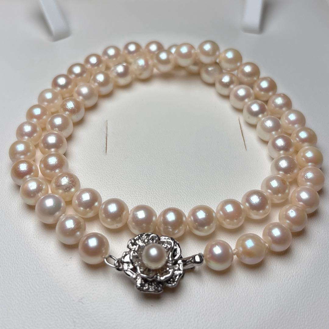 Akoya pearl necklace with 7.0-7.5mm round white pearls, 43cm length, teri wrapped with silver stamp