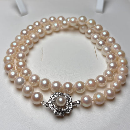 Akoya pearl necklace with 7.0-7.5mm round white pearls, 43cm length, teri wrapped with silver stamp