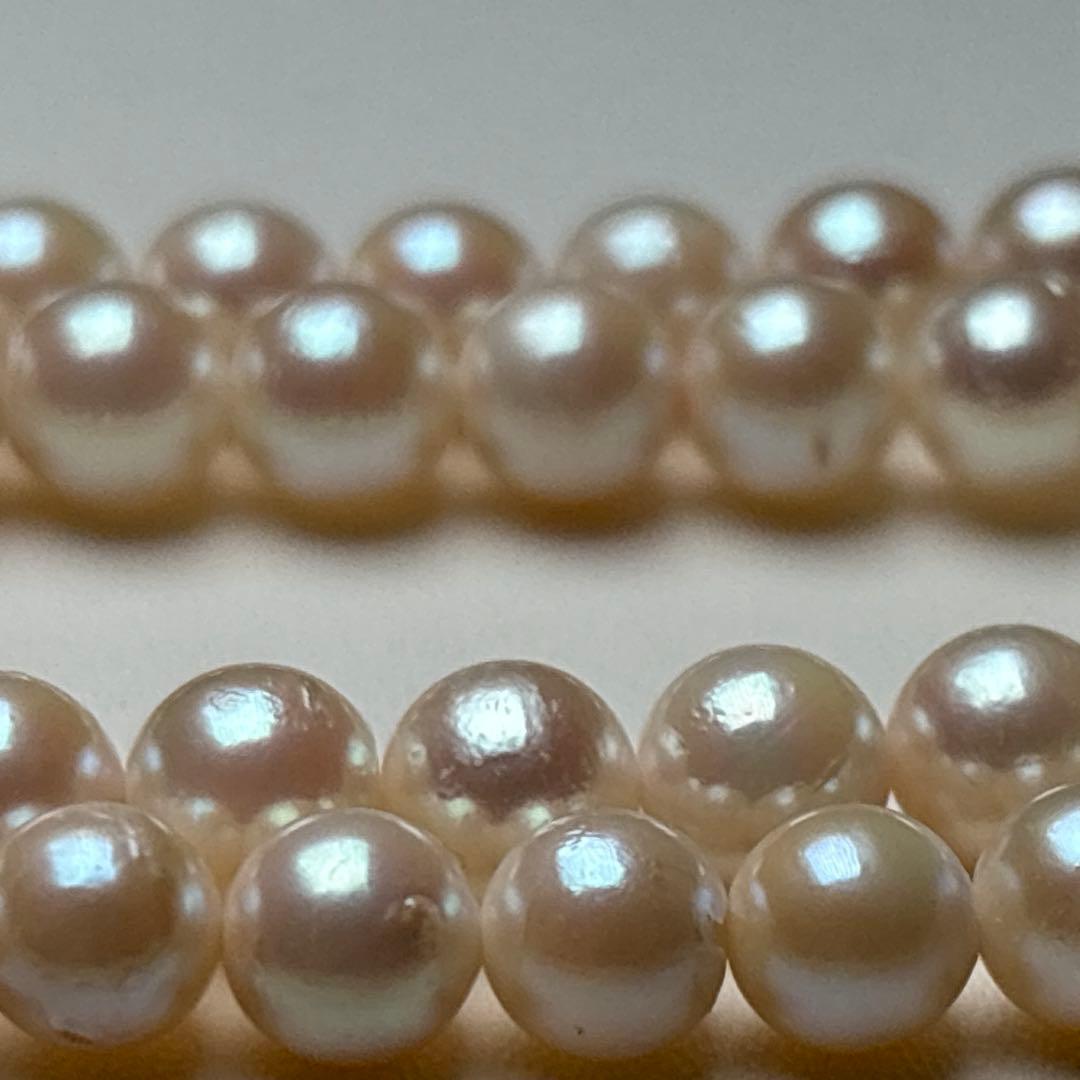 Akoya pearl necklace with 7.0-7.5mm round white pearls, 43cm length, teri wrapped with silver stamp