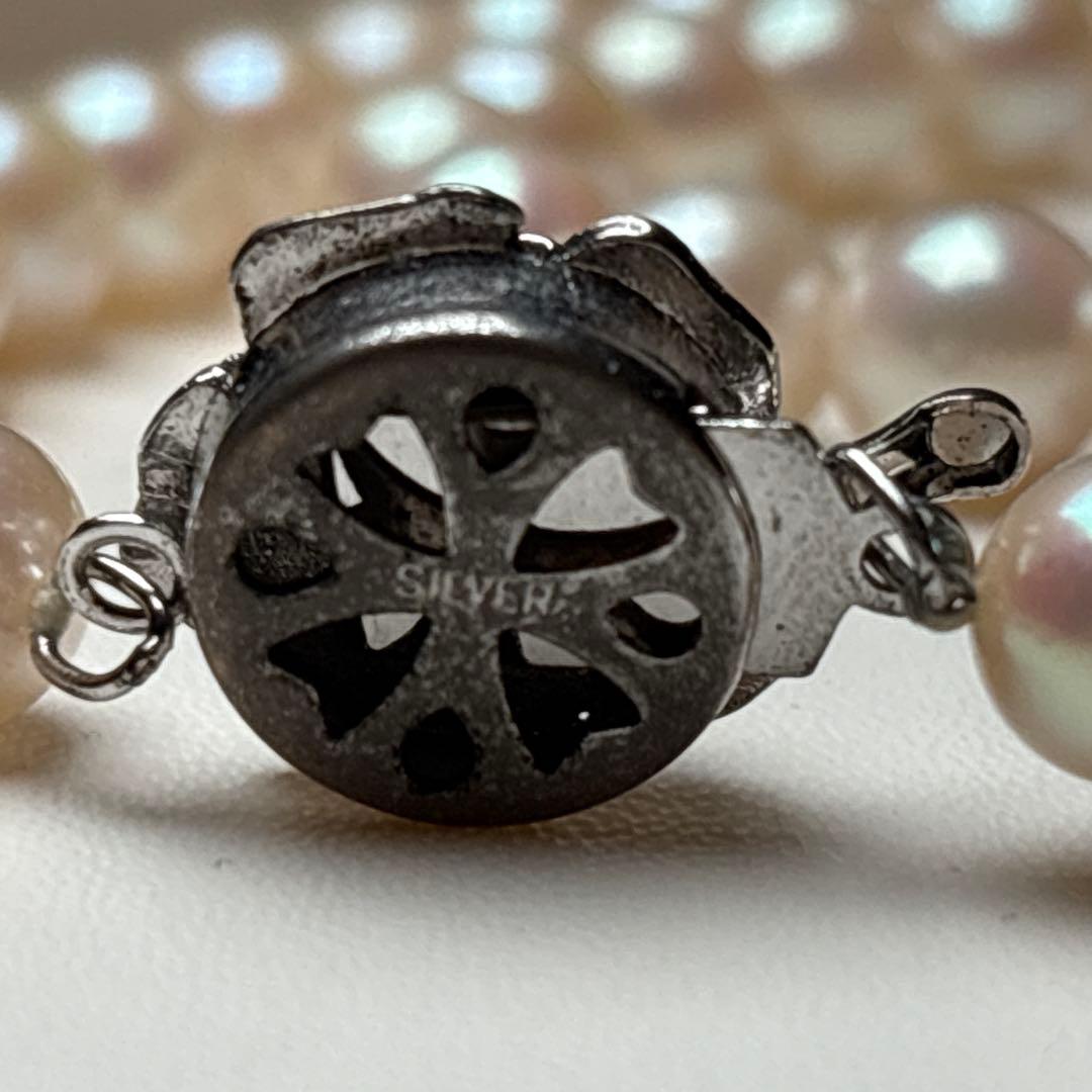 Akoya pearl necklace with 7.0-7.5mm round white pearls, 43cm length, teri wrapped with silver stamp
