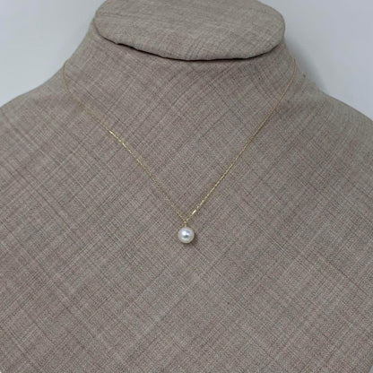 K18 gold necklace with a single 6mm Akoya pearl and a small birthstone on a 40cm chain