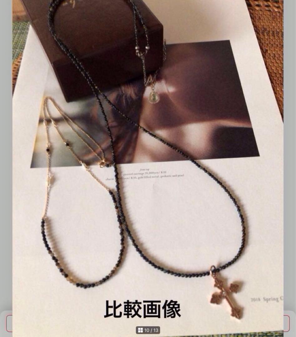 Agete SV Agate long sterling silver necklace with cross charm on white background