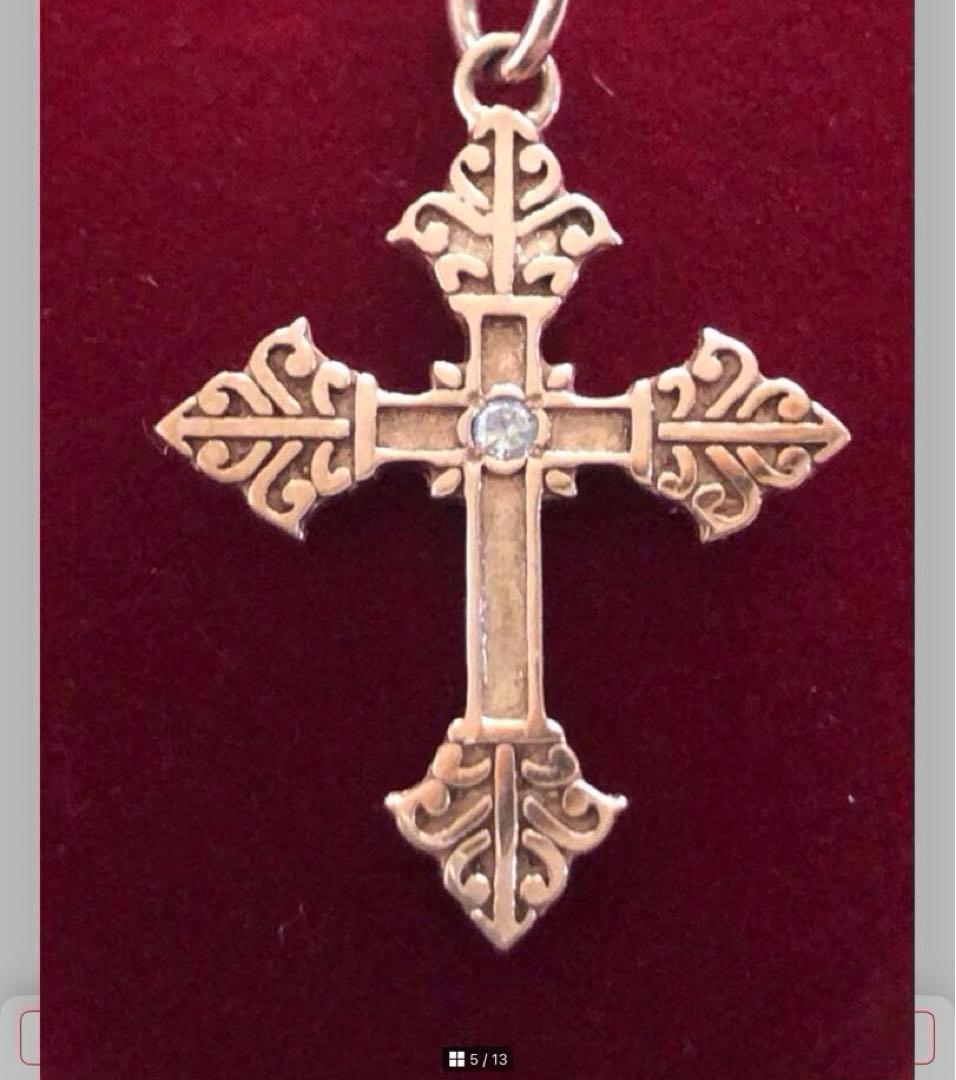 Agete SV Agate long sterling silver necklace with cross charm on white background