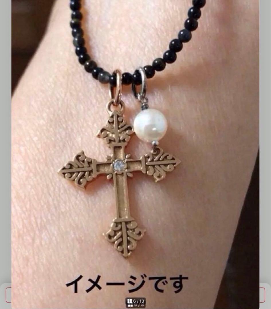 Agete SV Agate long sterling silver necklace with cross charm on white background