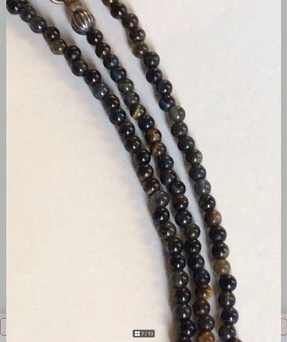 Agete SV Agate long sterling silver necklace with cross charm on white background