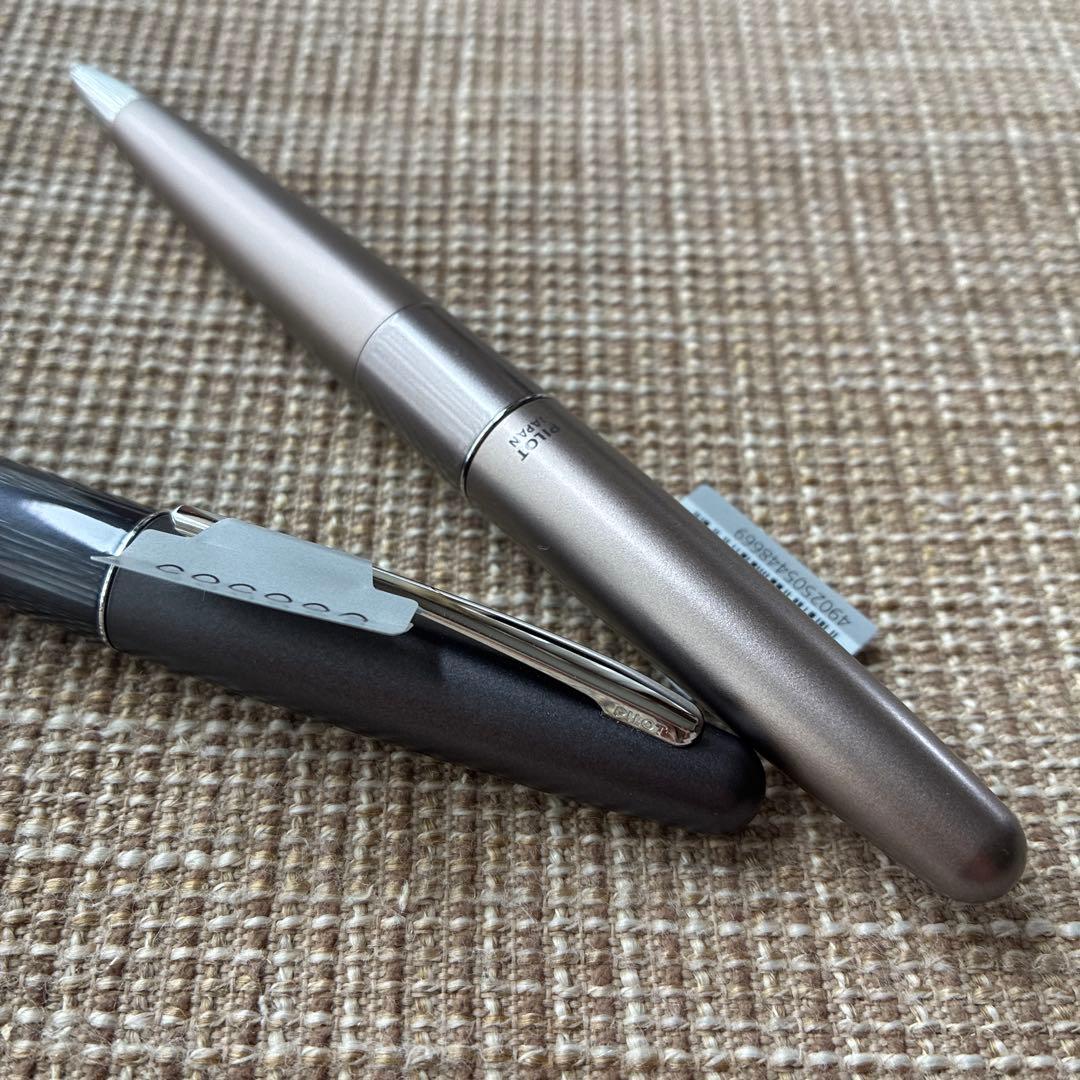 Two-piece set of Pilot Cocoon ballpoint pens with black ink and gray barrel shown side by side