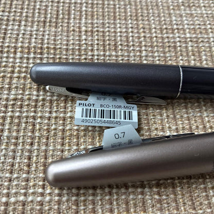 Two-piece set of Pilot Cocoon ballpoint pens with black ink and gray barrel shown side by side