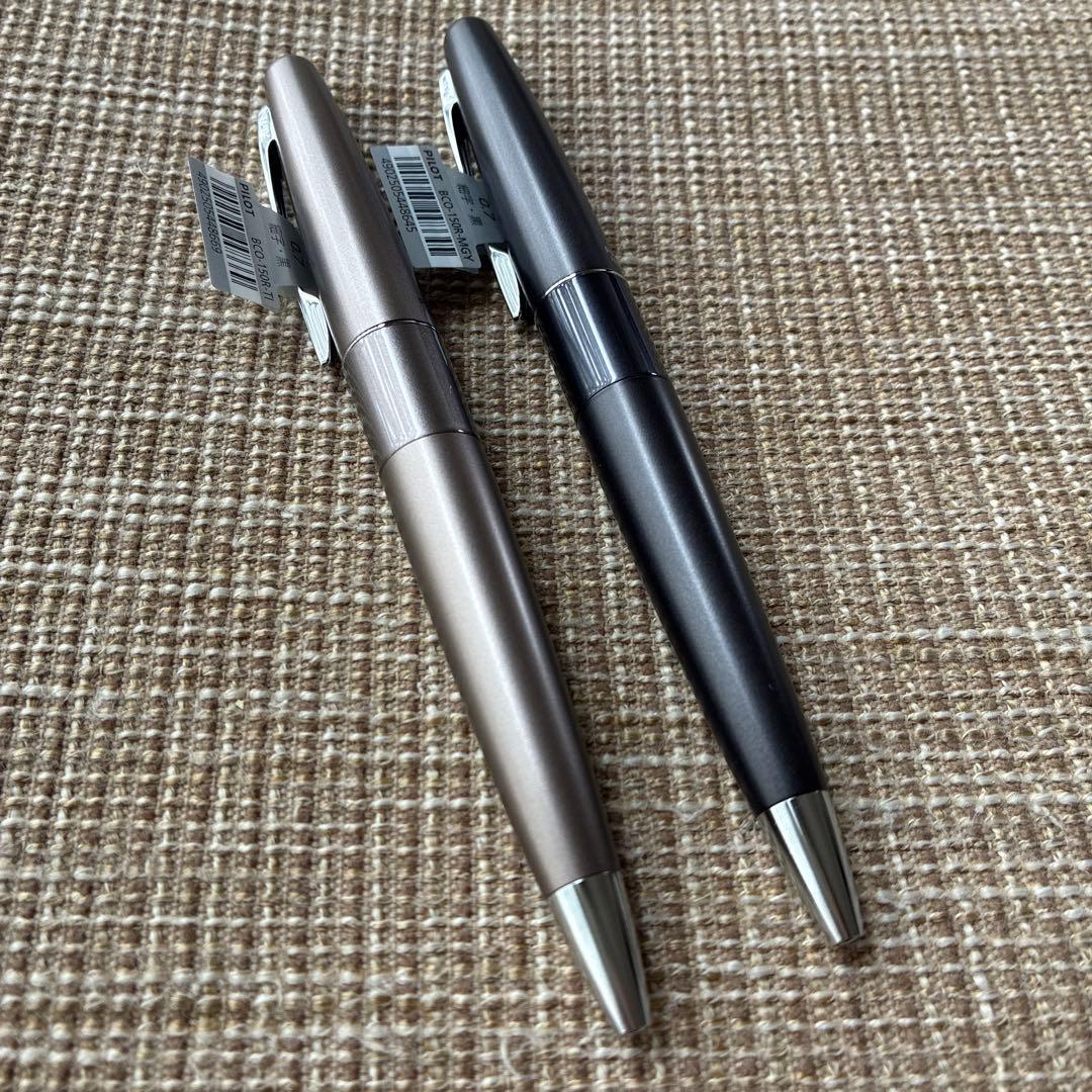 Two-piece set of Pilot Cocoon ballpoint pens with black ink and gray barrel shown side by side