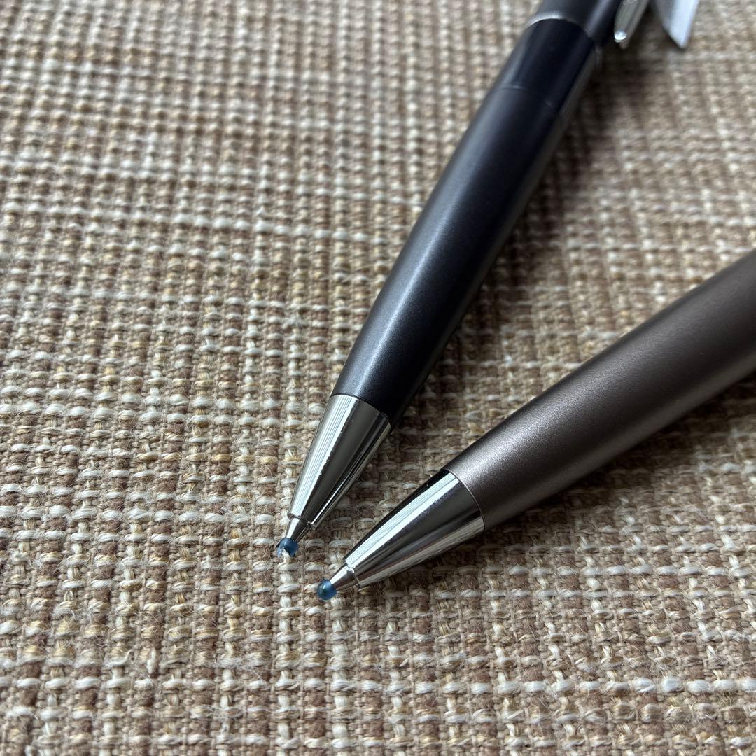Two-piece set of Pilot Cocoon ballpoint pens with black ink and gray barrel shown side by side