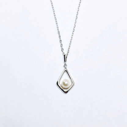 Mikimoto pearl necklace pendant with 4.5mm white pearls on a silver chain