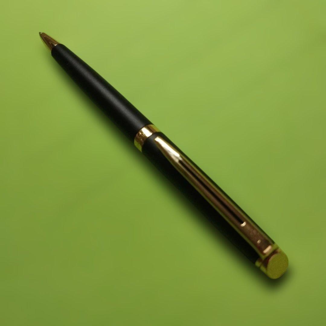 WATERMAN ballpoint pen in matte black with gold trim shown on white background