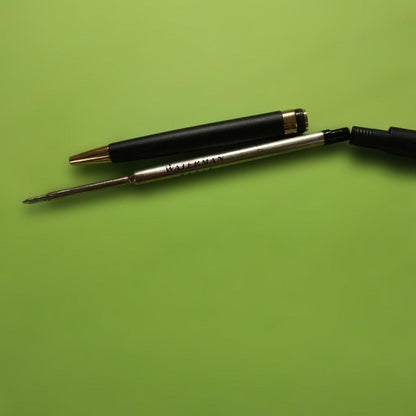 WATERMAN ballpoint pen in matte black with gold trim shown on white background