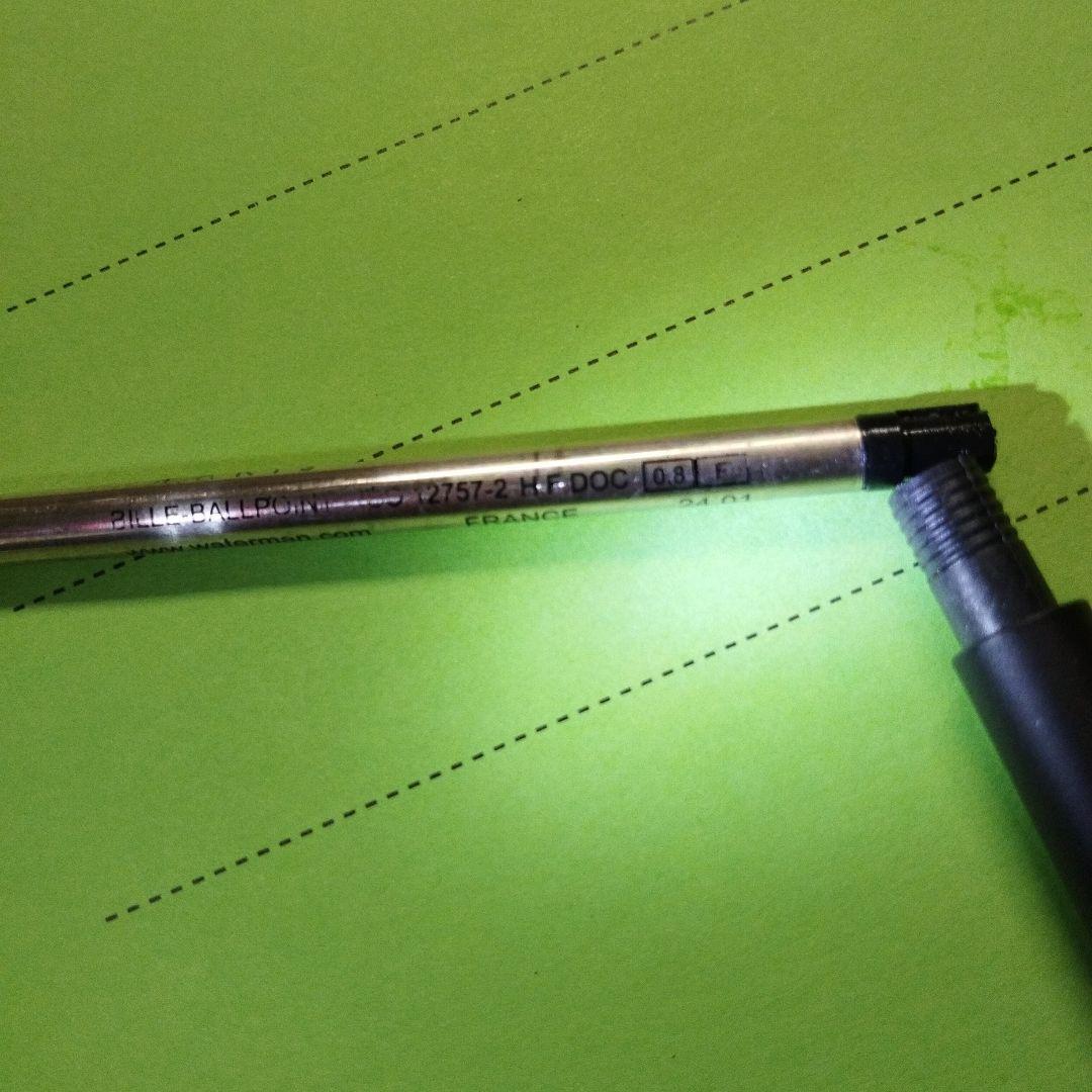 WATERMAN ballpoint pen in matte black with gold trim shown on white background