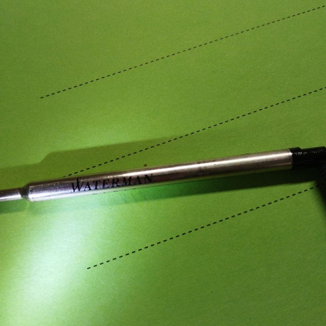 WATERMAN ballpoint pen in matte black with gold trim shown on white background