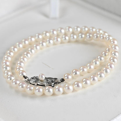 Hana-dama grade Mikimoto Akoya pearl necklace with round 6-5.5mm pearls and silver clasp in aurora pink color