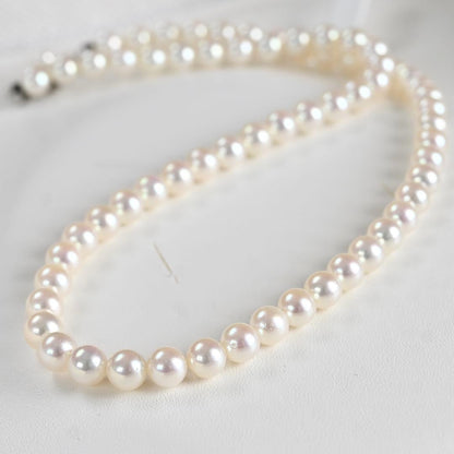 Hana-dama grade Mikimoto Akoya pearl necklace with round 6-5.5mm pearls and silver clasp in aurora pink color