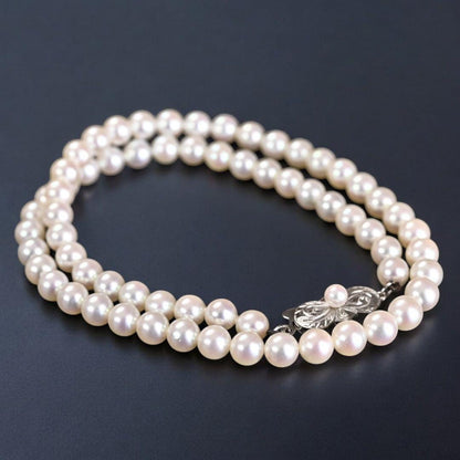 Hana-dama grade Mikimoto Akoya pearl necklace with round 6-5.5mm pearls and silver clasp in aurora pink color