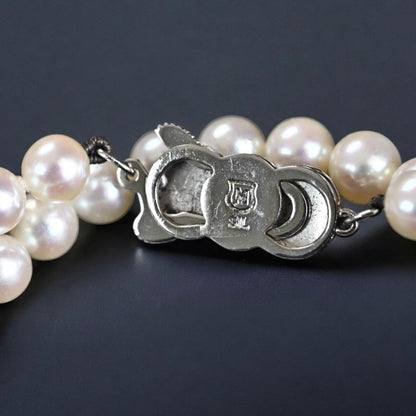 Hana-dama grade Mikimoto Akoya pearl necklace with round 6-5.5mm pearls and silver clasp in aurora pink color