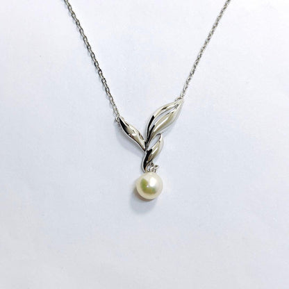 Mikimoto pearl necklace featuring a 6.7mm pearl and silver leaf pendant on a 42cm chain