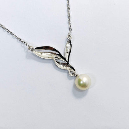 Mikimoto pearl necklace featuring a 6.7mm pearl and silver leaf pendant on a 42cm chain
