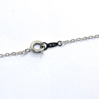 Mikimoto pearl necklace featuring a 6.7mm pearl and silver leaf pendant on a 42cm chain