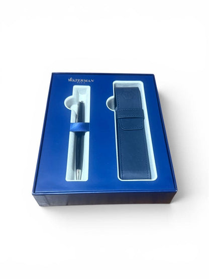 WATERMAN ballpoint pen with black body and blue dedicated pen case set on white background