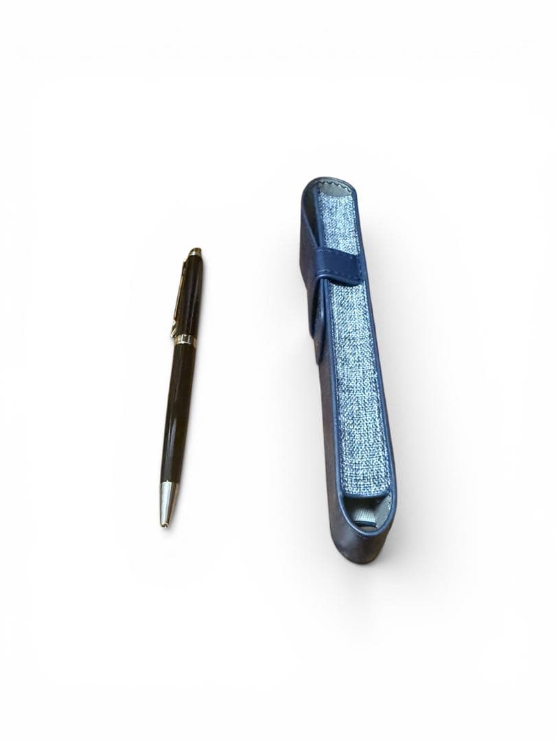 WATERMAN ballpoint pen with black body and blue dedicated pen case set on white background