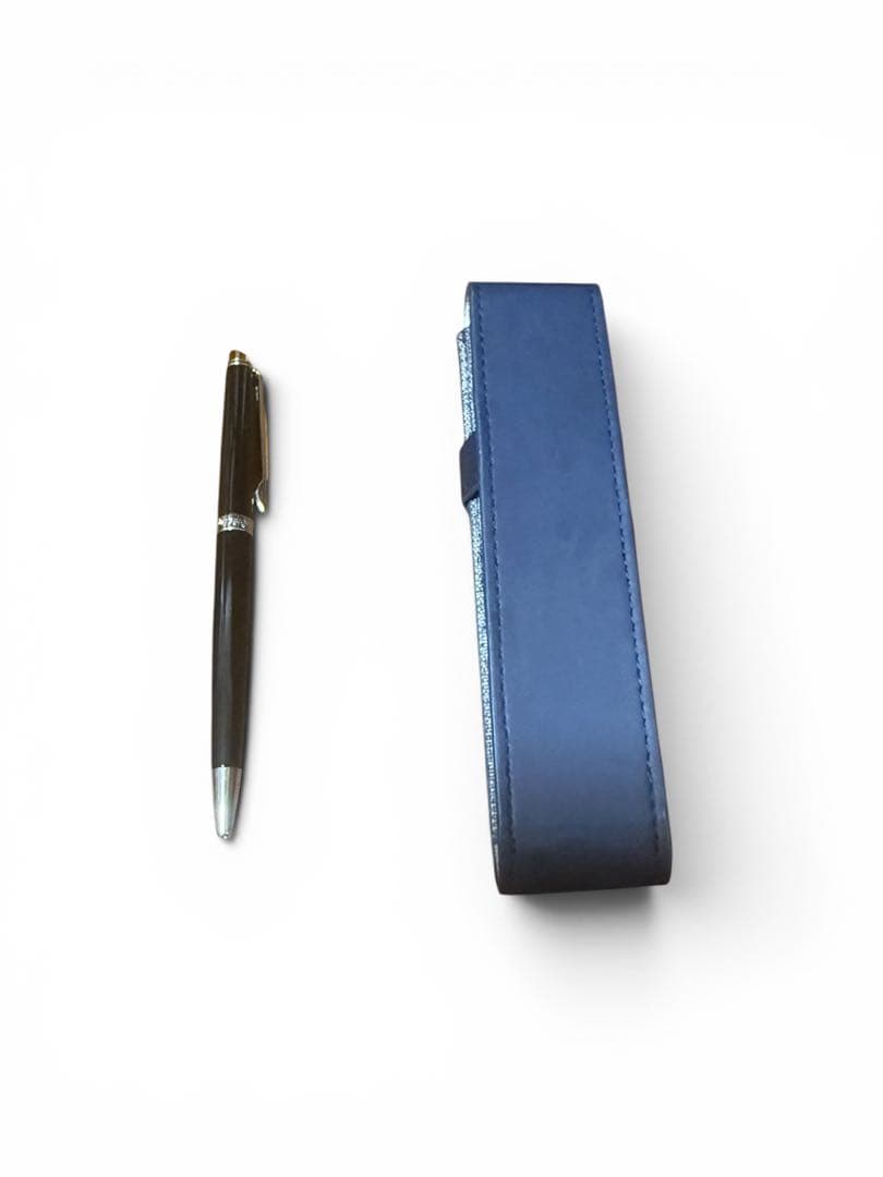 WATERMAN ballpoint pen with black body and blue dedicated pen case set on white background
