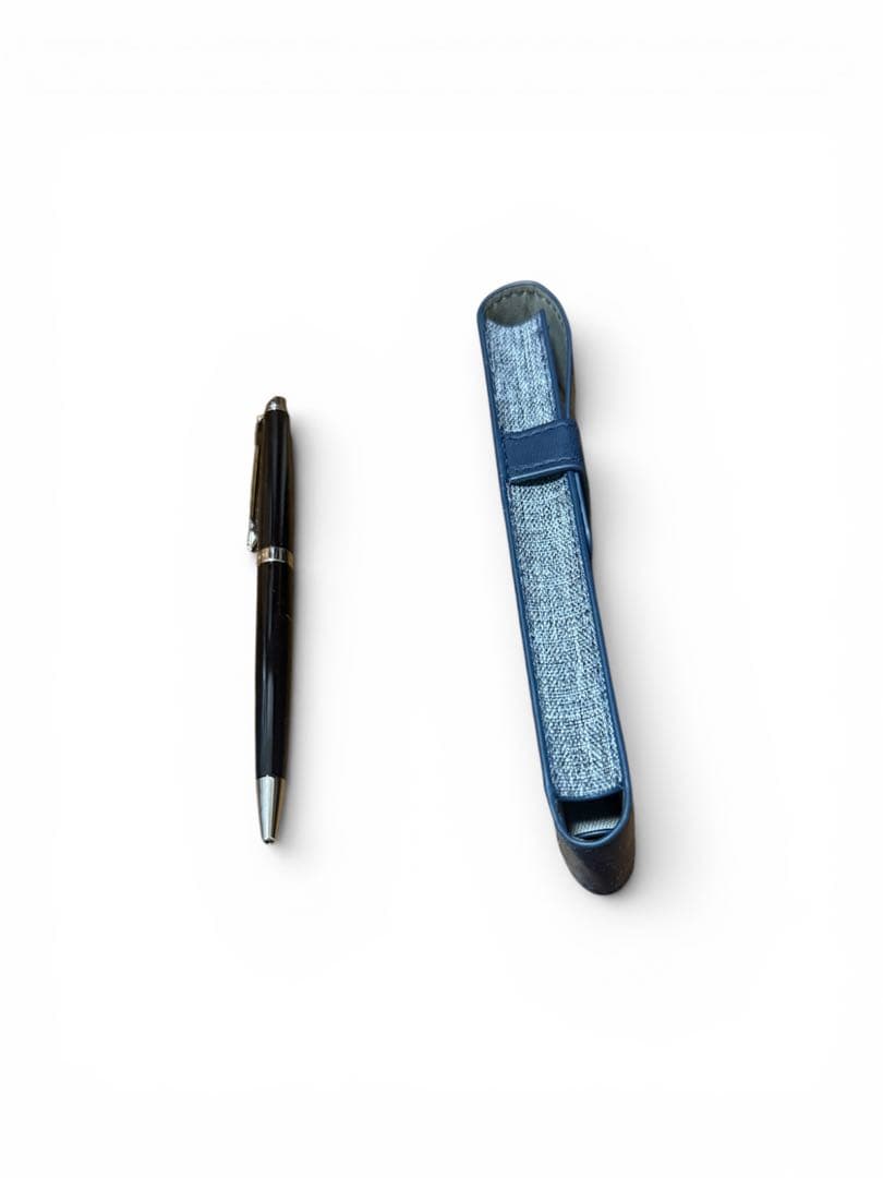 WATERMAN ballpoint pen with black body and blue dedicated pen case set on white background