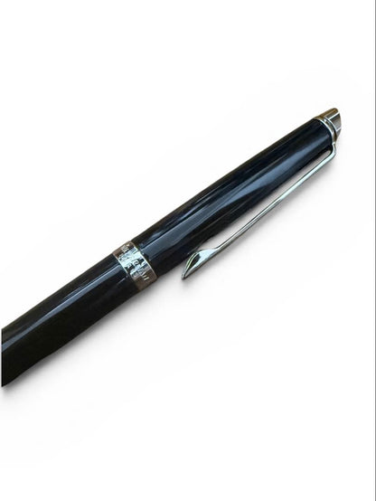 WATERMAN ballpoint pen with black body and blue dedicated pen case set on white background