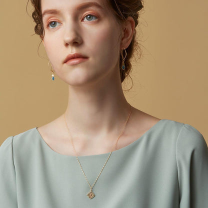 Agete K10 yellow gold charm necklace featuring a sparkling diamond pendant