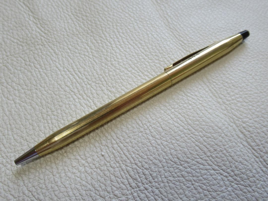 Set of three Cross Classic Century metal ballpoint pens on white background