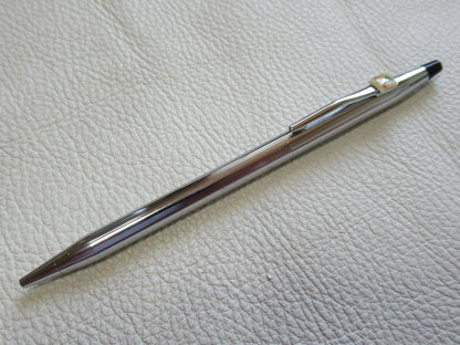 Set of three Cross Classic Century metal ballpoint pens on white background